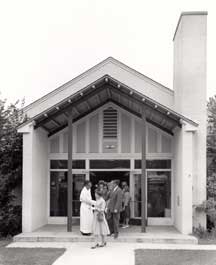 The Rev. Fred Pope greets parishioners after services in the Parish House.